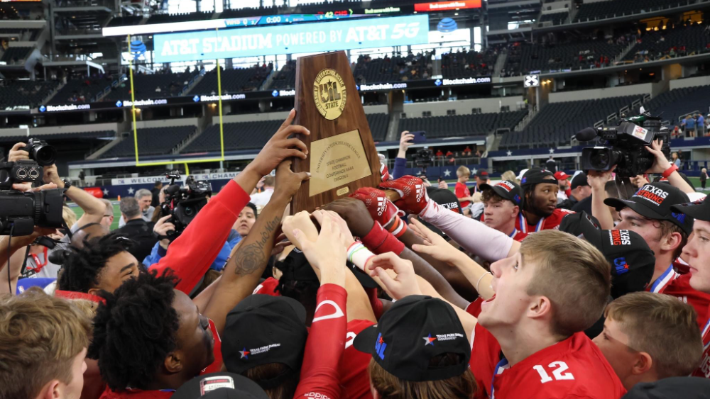 Bulldog Football Team with State Championship Trophy